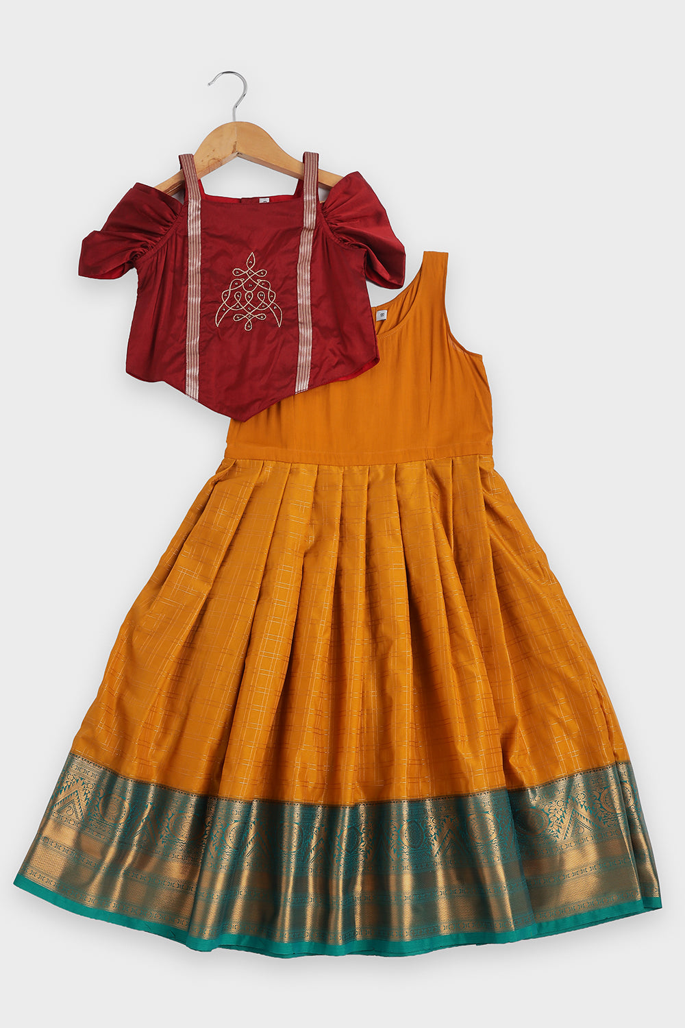 Chittythalli Girls Traditional Pavadai Set | Art Silk V-Cut Maroon Top with Gathered Cold Shoulder Sleeves & Kolam Motif Embroidery | Green Knife Pleated Skirt | Back Open Gold Button | Woven Ethnic Wear for Girls - PS005