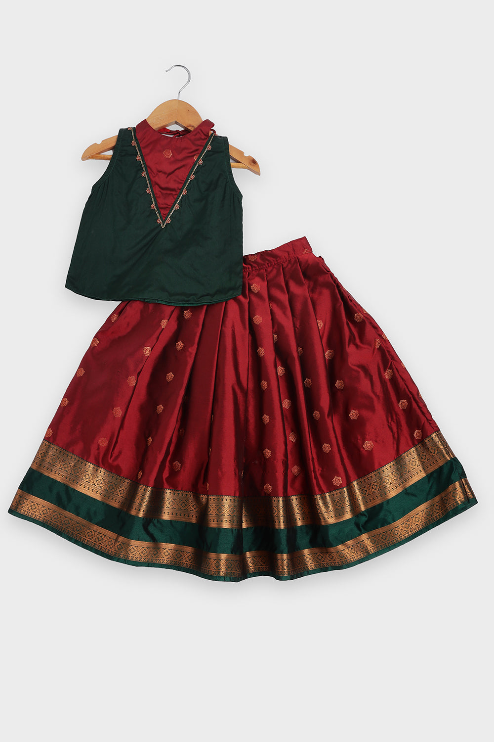 Chittythalli Girls Traditional Pavadai Set | Art Silk Green Sleeveless Top with Red Neck Tie Panel | Minimal Embroidery Hemline | Maroon Knife Pleated Skirt | Woven Ethnic Wear for Girls - PS008