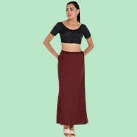 Woman wearing a maroon saree petticoat with a black blouse