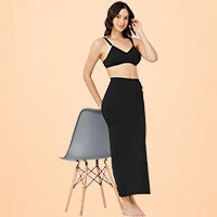 Woman wearing black saree shapewear and a black bra