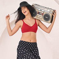Woman wearing a red T-shirt bra and black hat, holding a boombox